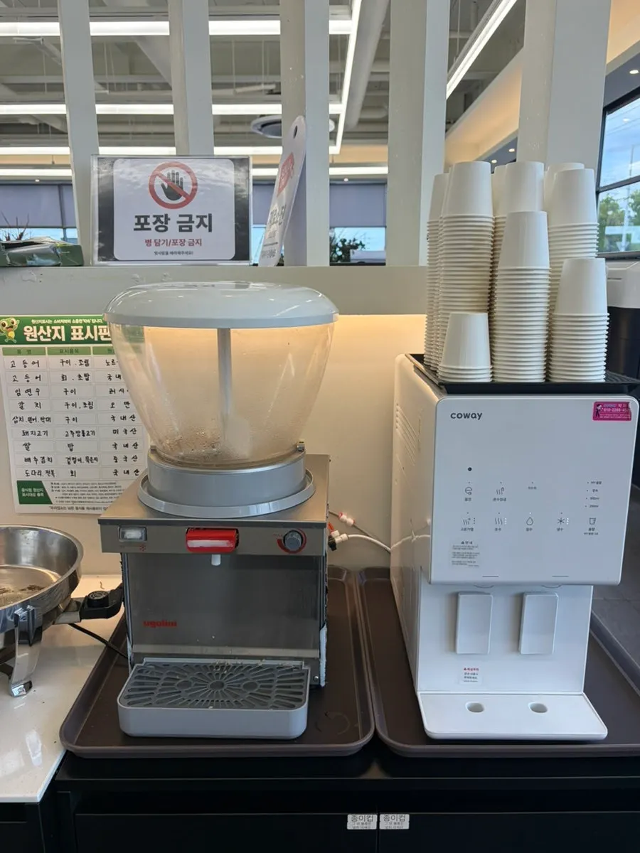 Rows of side dishes lined up at the self-serve bar