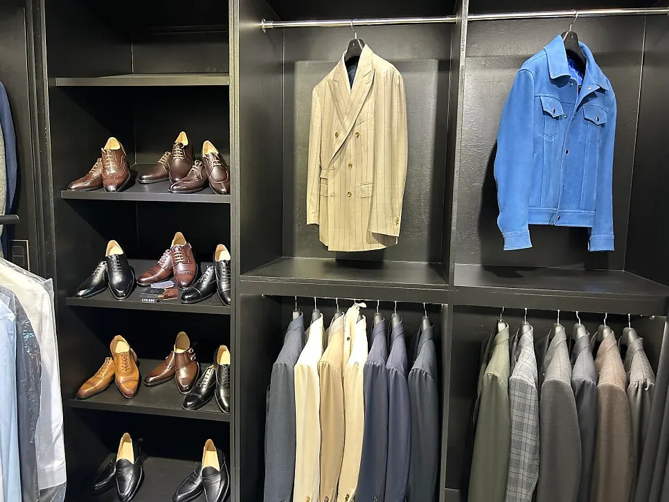 Inside the shop during a wedding suit consultation