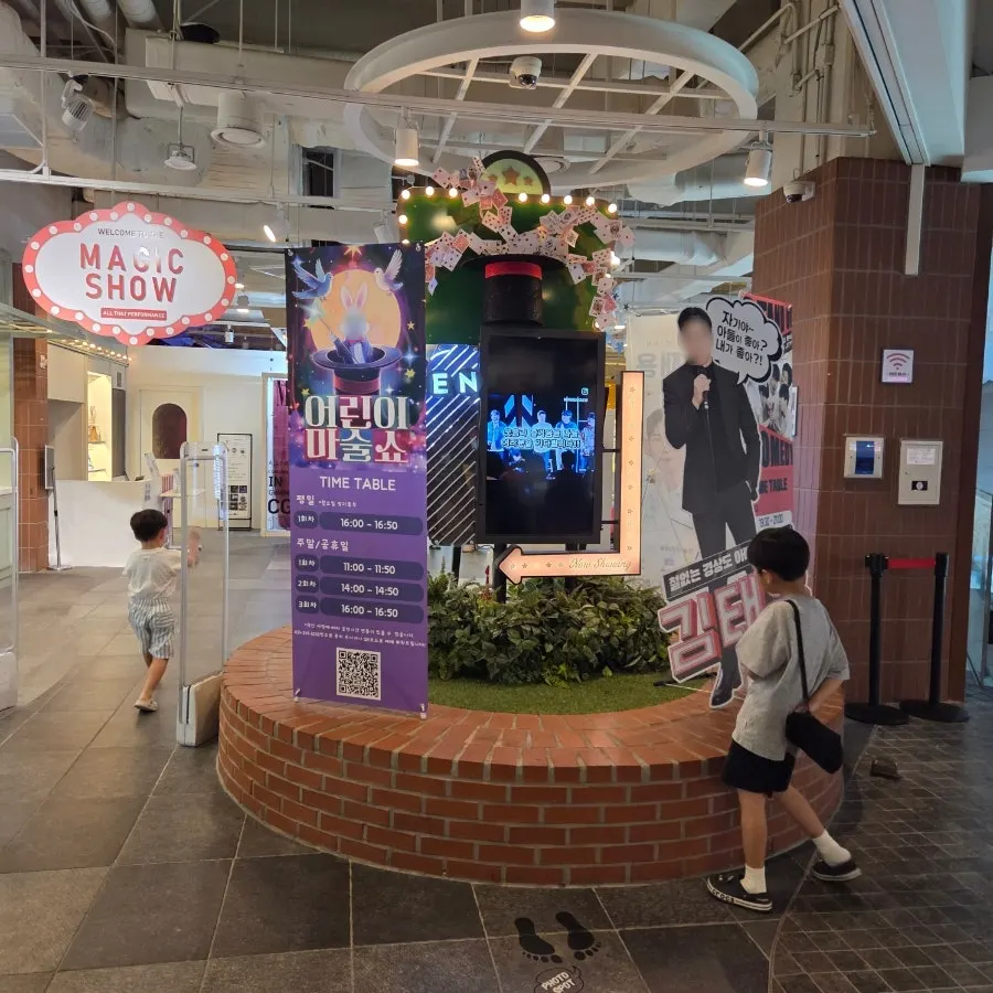 Watching the magic show at Magic & Joy Gwanggyo