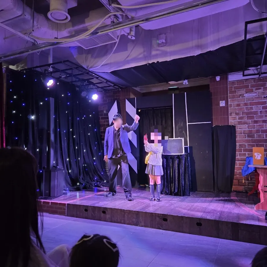 A magic trick on stage at Magic & Joy Gwanggyo