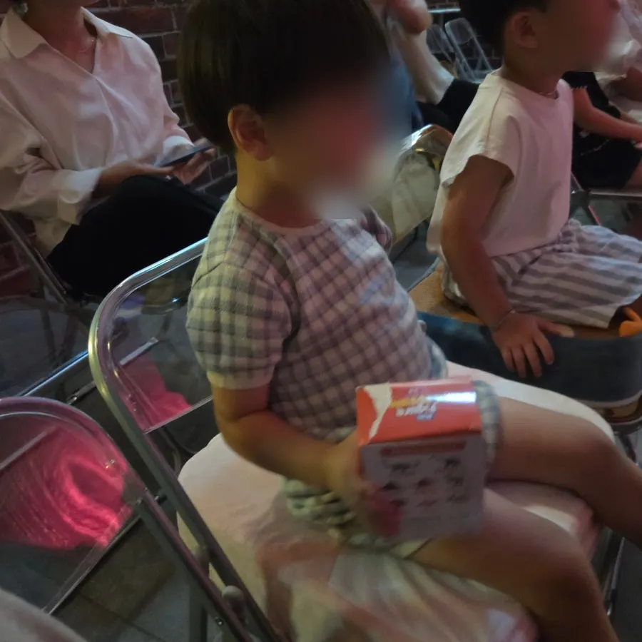 Kids in the audience watching the magic show
