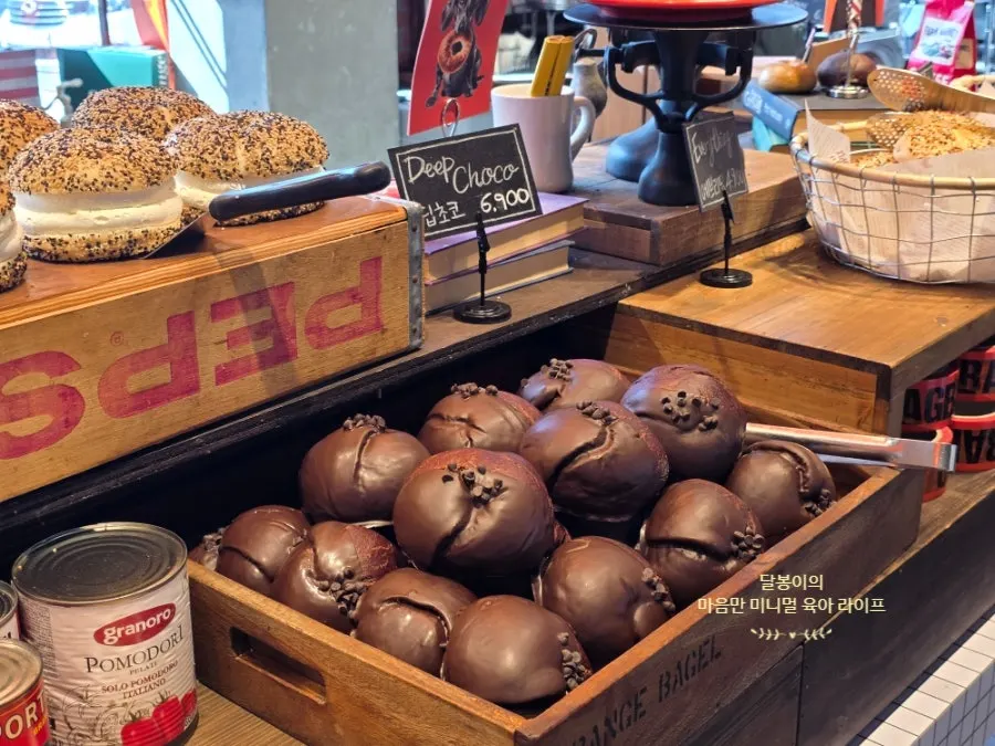 Various bagels displayed at Orange Bagel