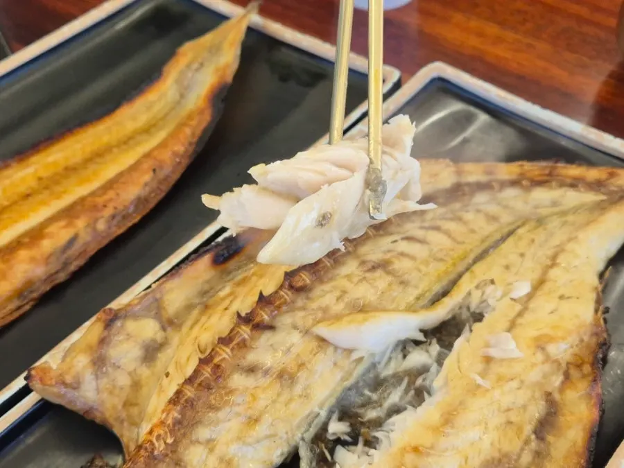Flesh picked from the grilled croaker