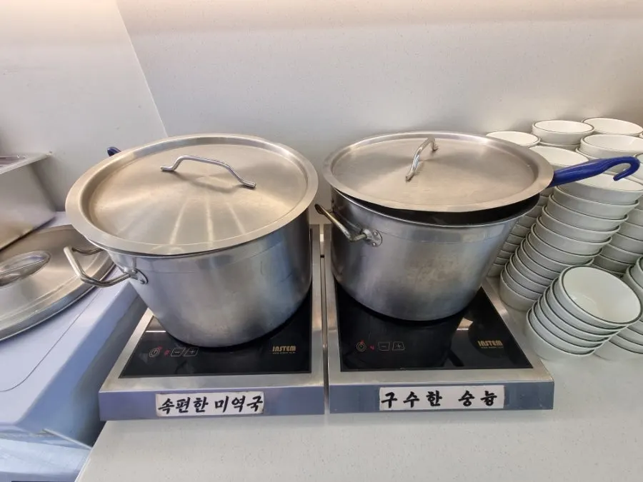 Mini pork stir-fry served alongside the basic side dishes
