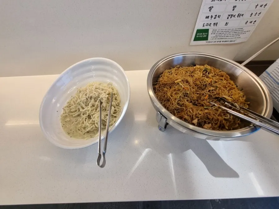 Sweet rice punch and side dish containers at the self-serve bar