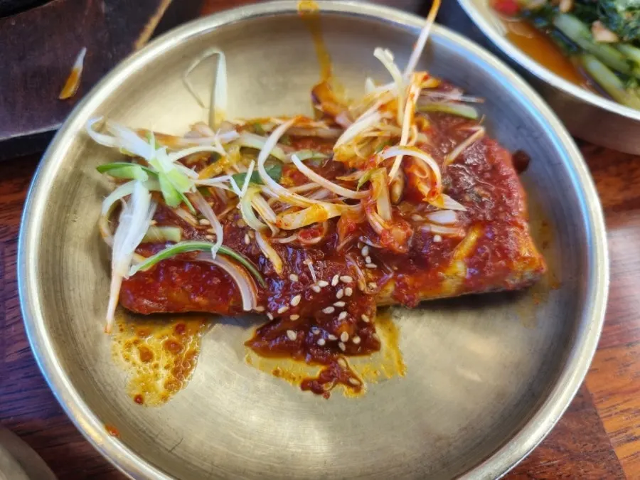 Close-up of braised cutlassfish soaked in sauce