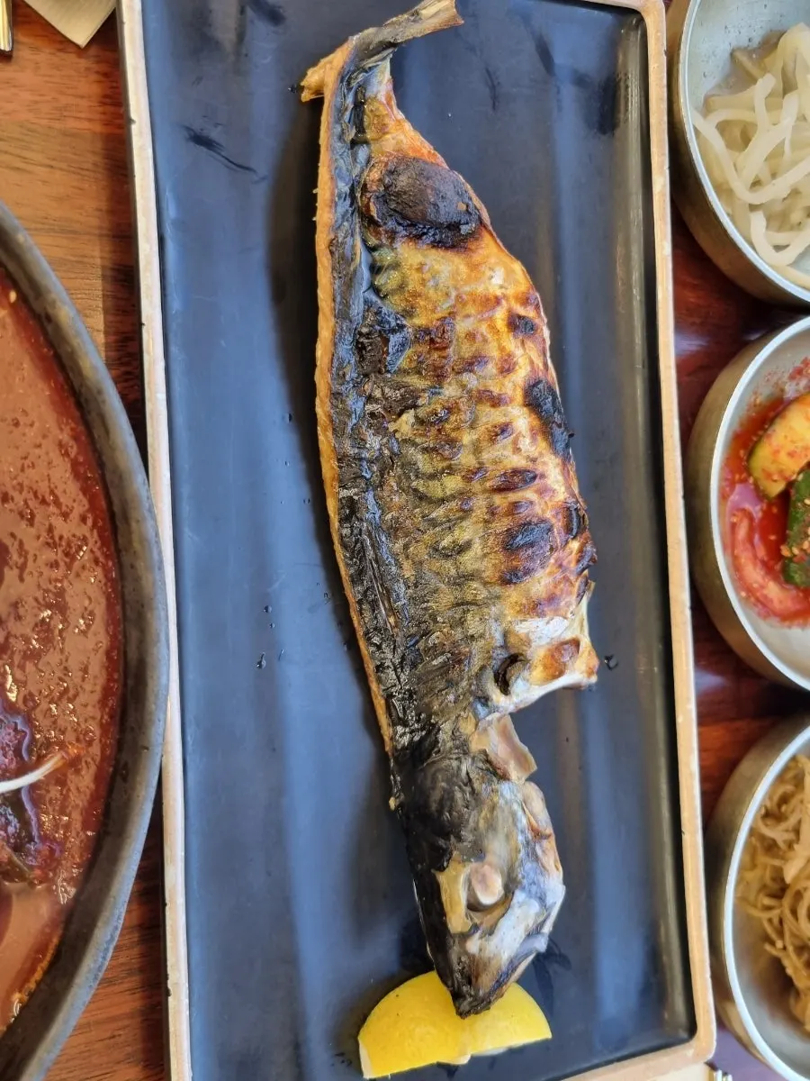 A plate of grilled mackerel fresh from the wood-fired oven