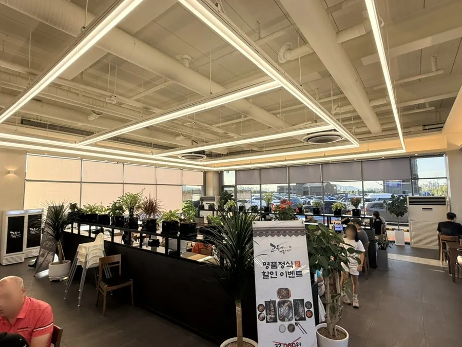 Spacious restaurant interior with floor-to-ceiling windows