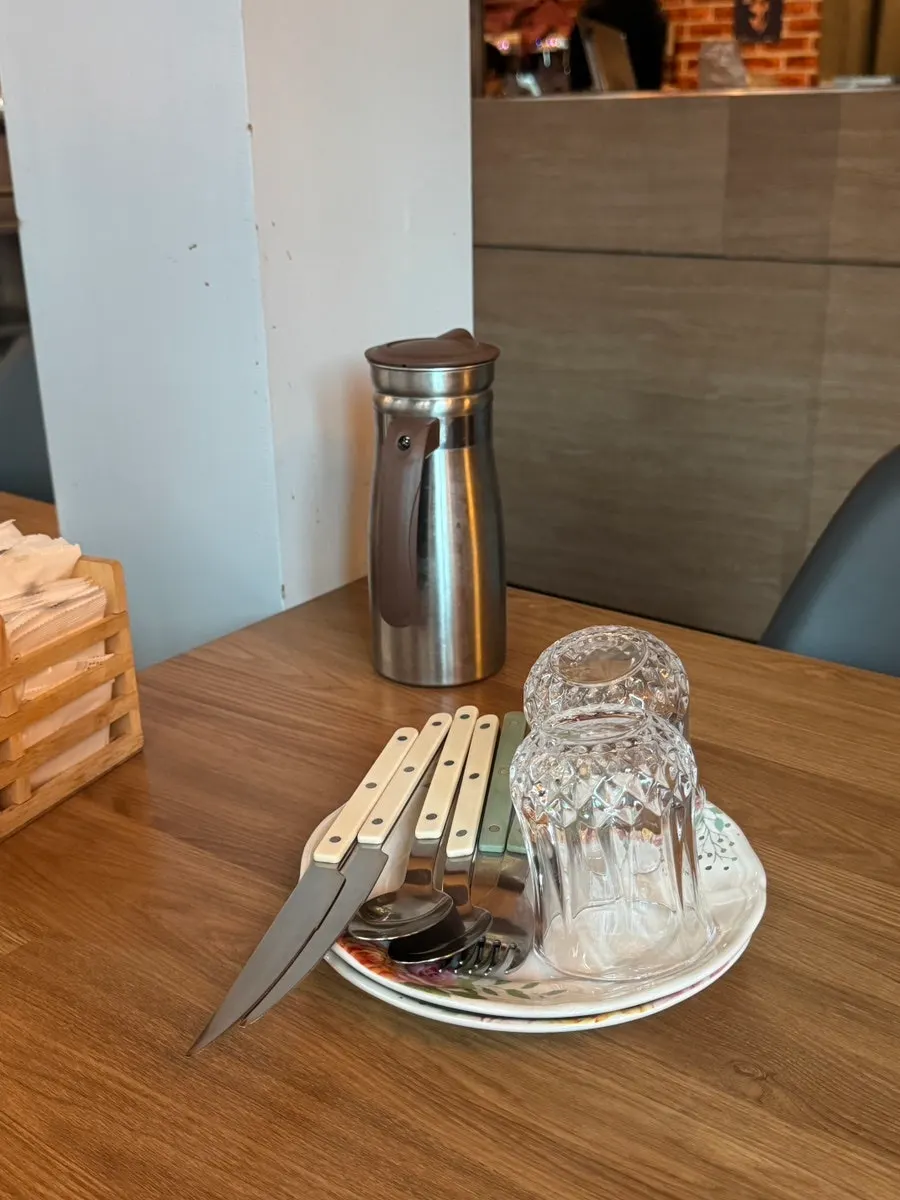 Table set with tableware and water