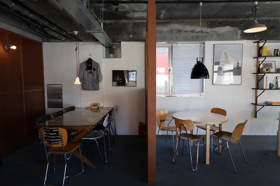 Dark, hip café interior with wood-tone furniture
