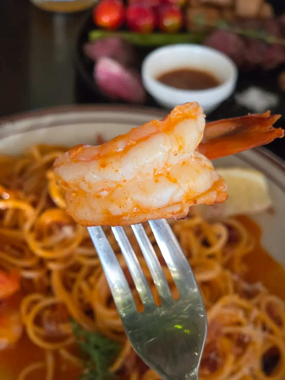 Plump shrimp on top of the bisque rosé pasta