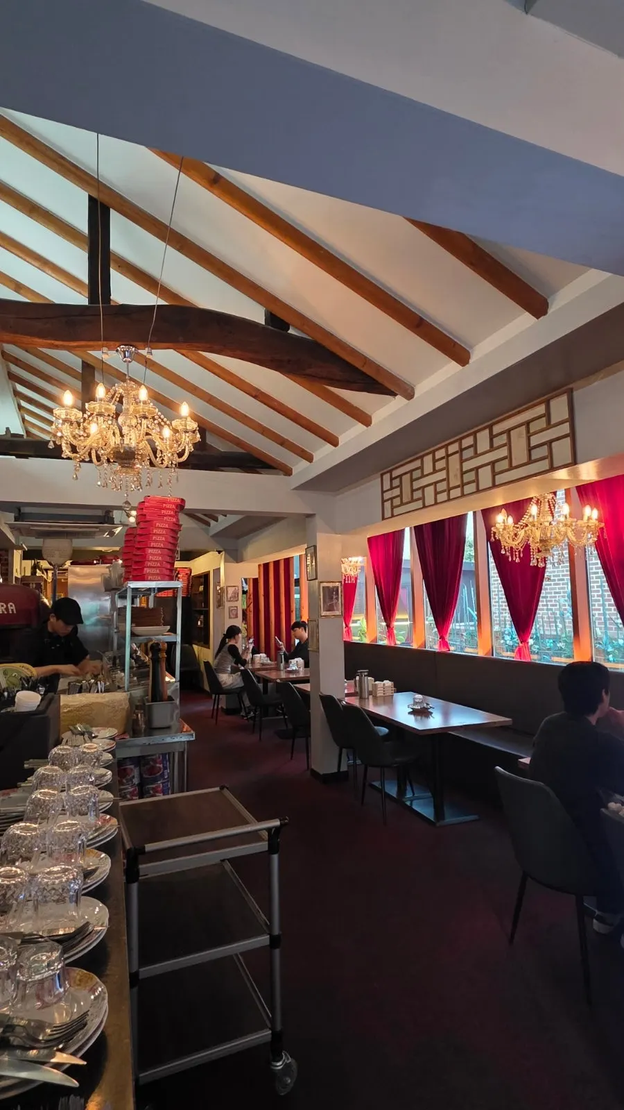 Store interior with red curtains and chandeliers
