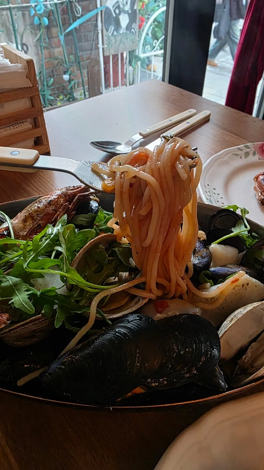 Vertical photo showing the chunky shrimp in the pasta