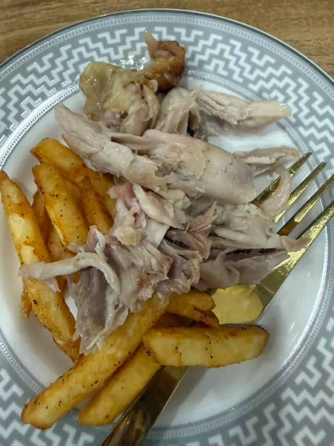Fries and tteok served alongside the chicken