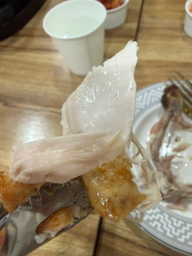 Chewy tteok stretching as it's pulled apart
