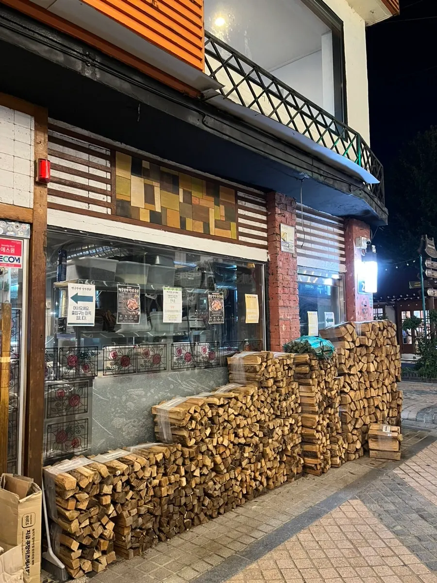 Firewood stacked in front of the restaurant