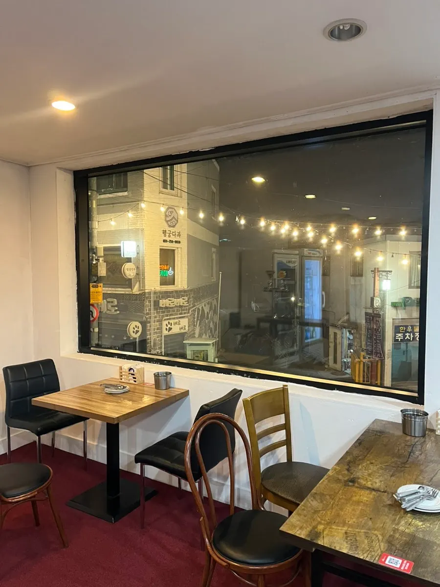 2nd floor seating with floor-to-ceiling windows