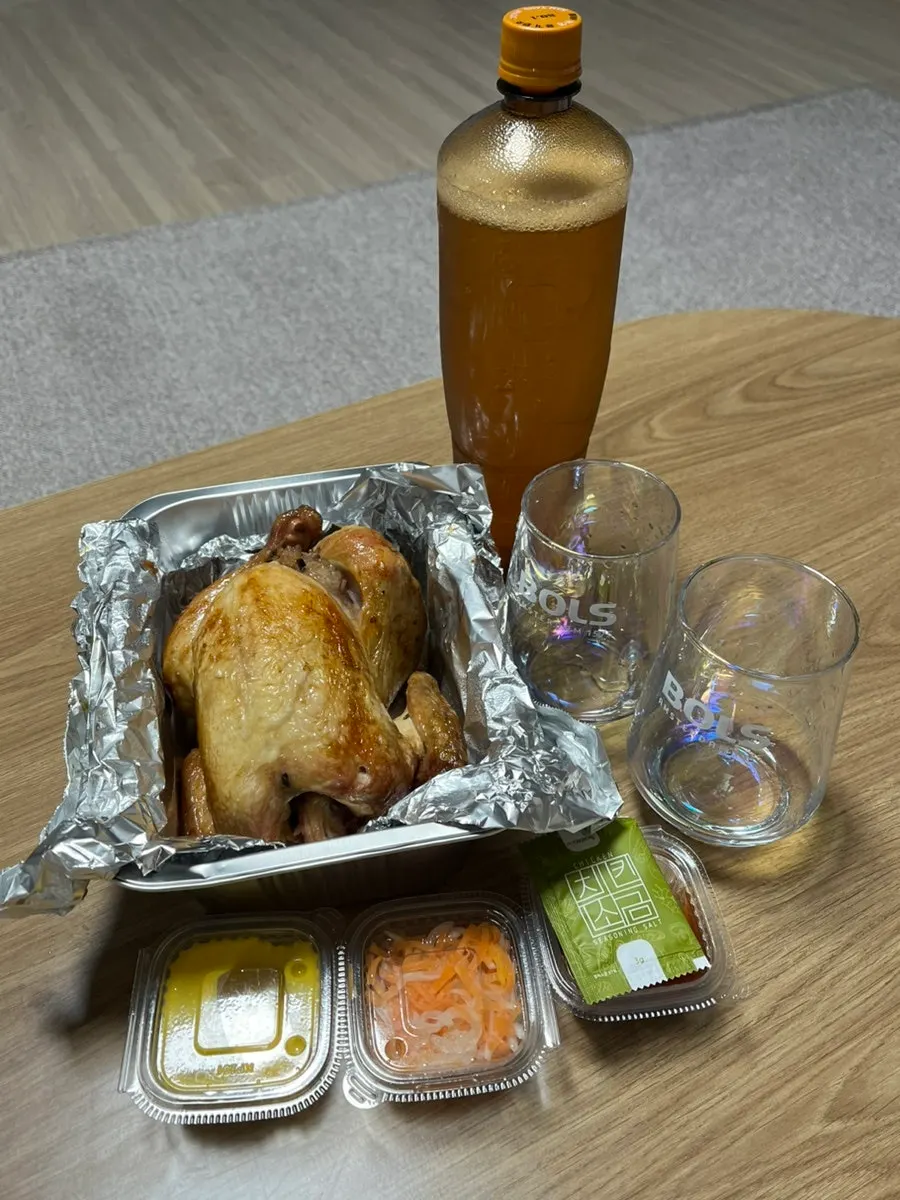 Takeout chicken and draft beer set up at home