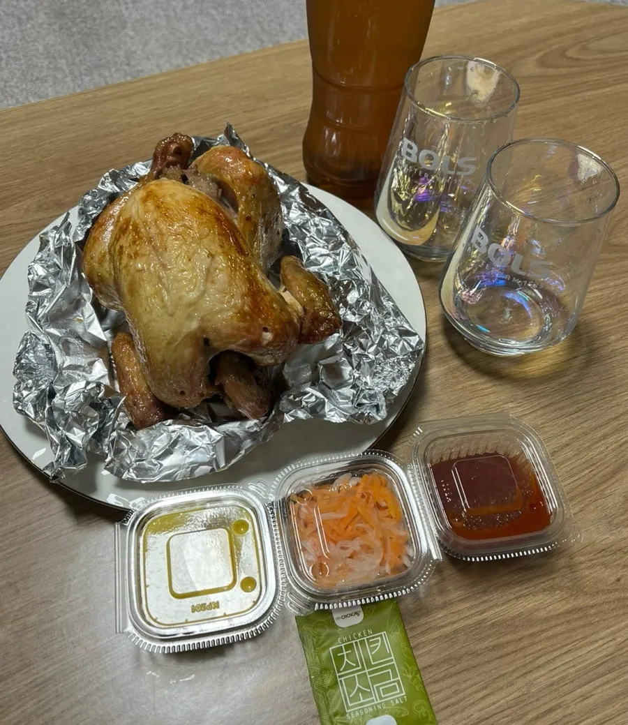 Oak-fired chicken transferred onto a wide plate