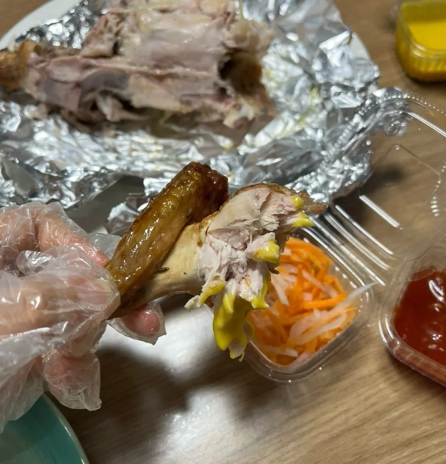 Chicken wing held in hand