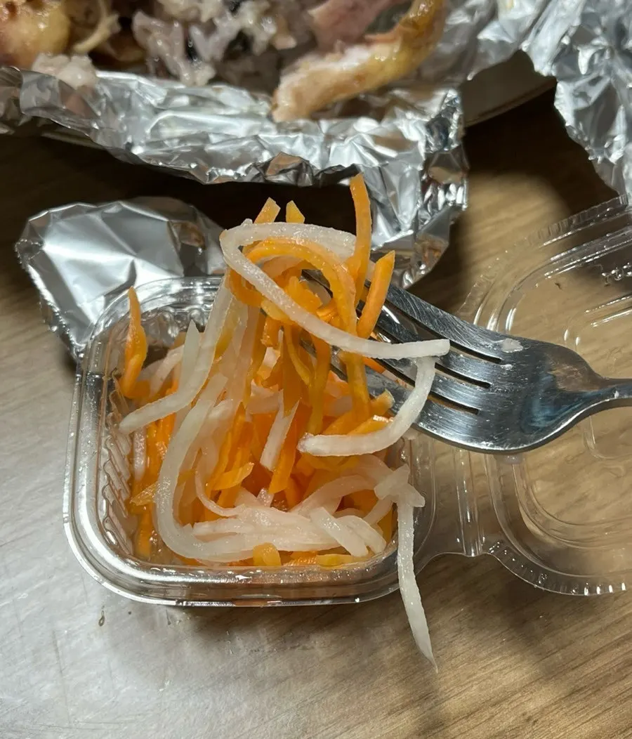 Pickled radish and carrot served alongside