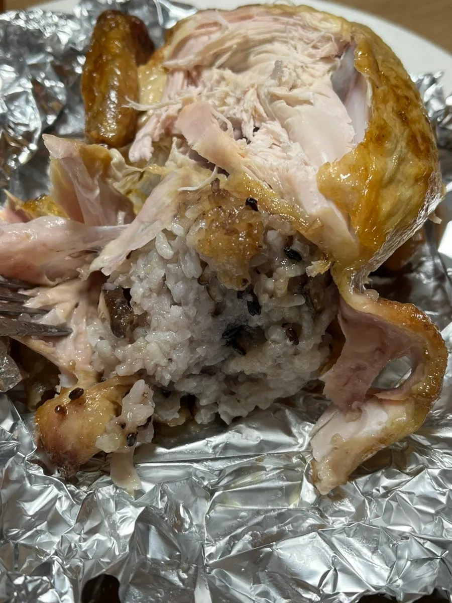 Sticky rice packed inside the whole chicken