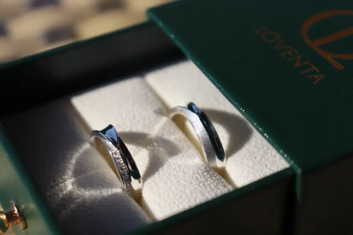 Hand wearing the finished LEAF couple ring
