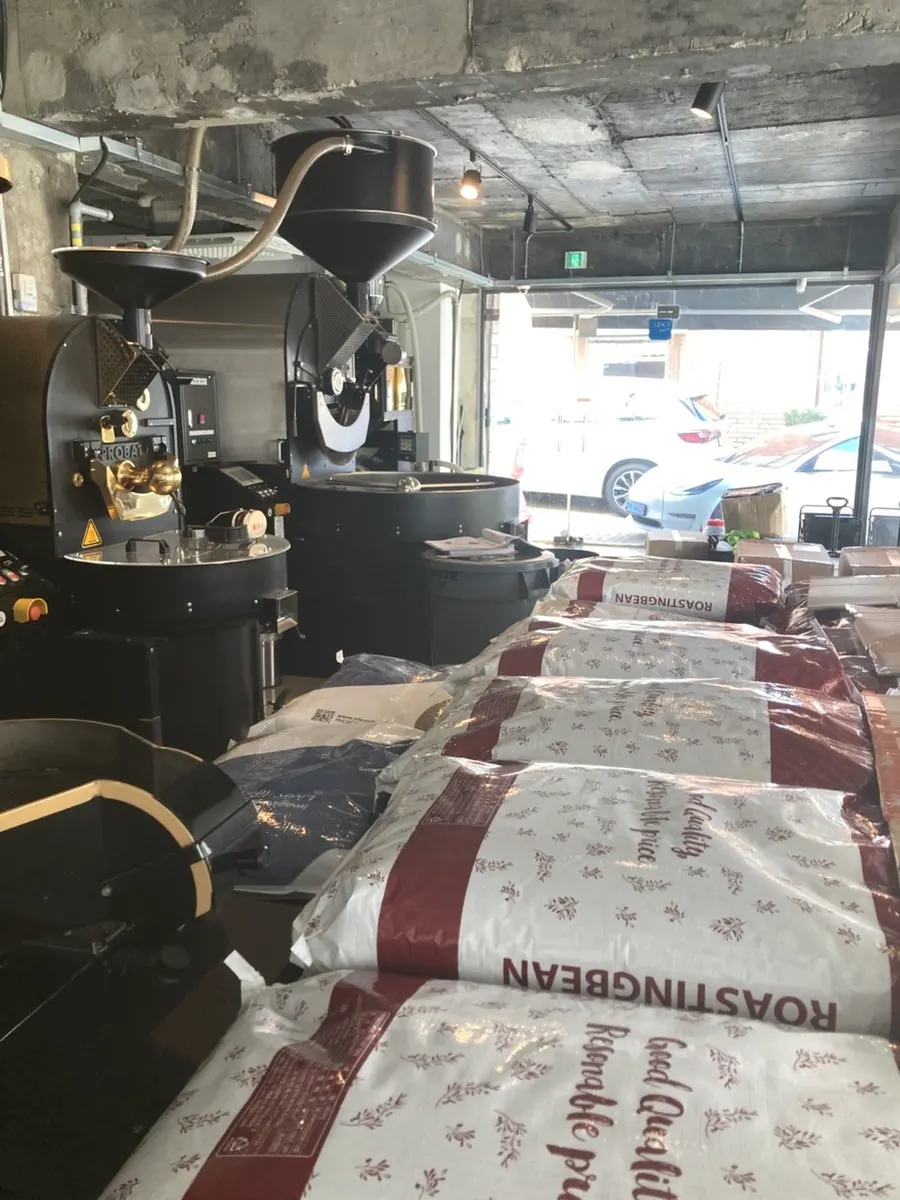 Roasting machine visible through the floor-to-ceiling window