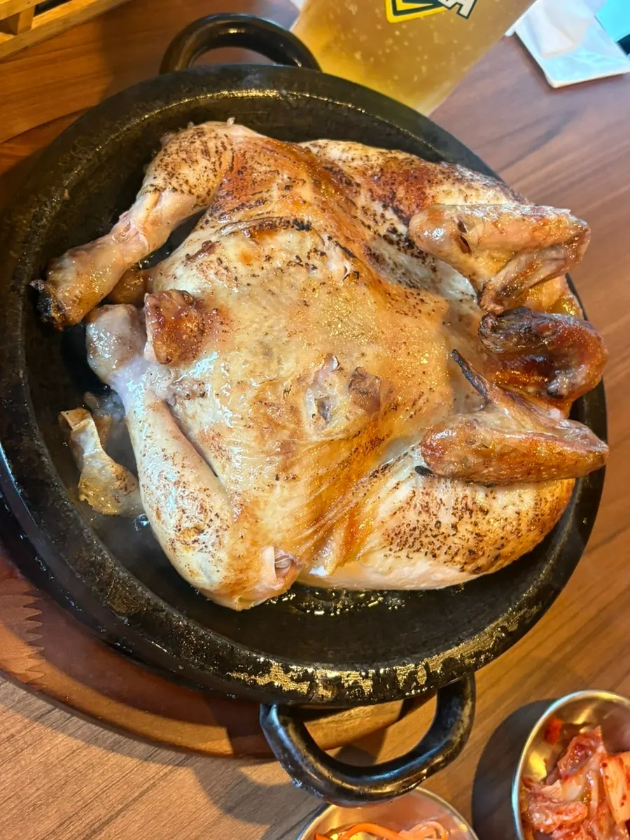Whole chicken on a stone plate with Terra draft beer