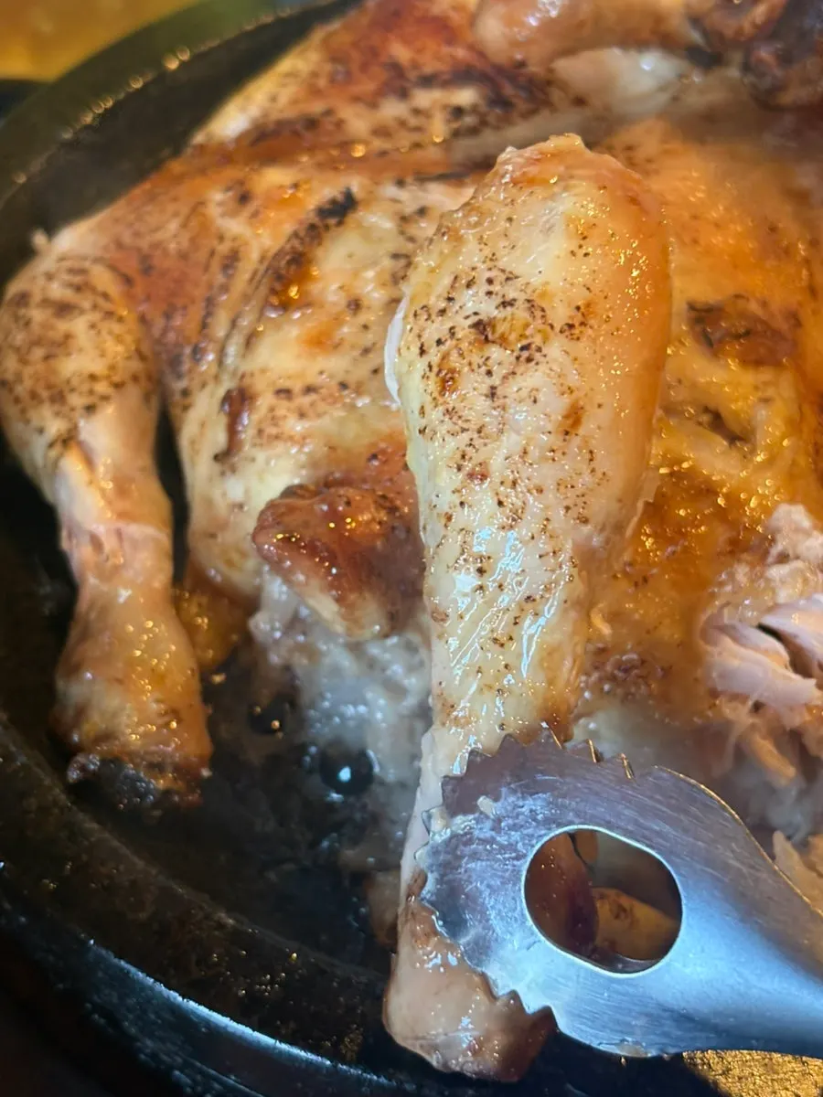 Sweet rice packed inside the whole chicken