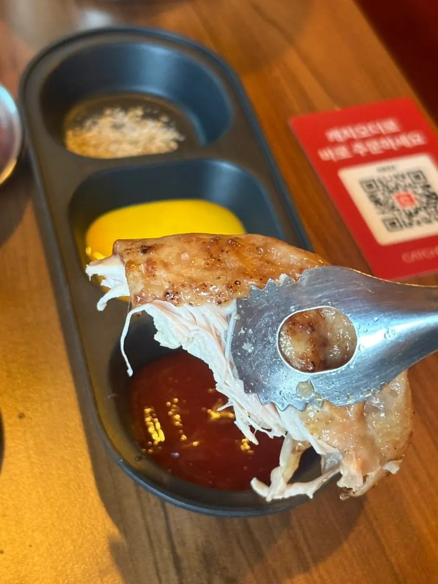 A bite of chicken meat and sweet rice served together