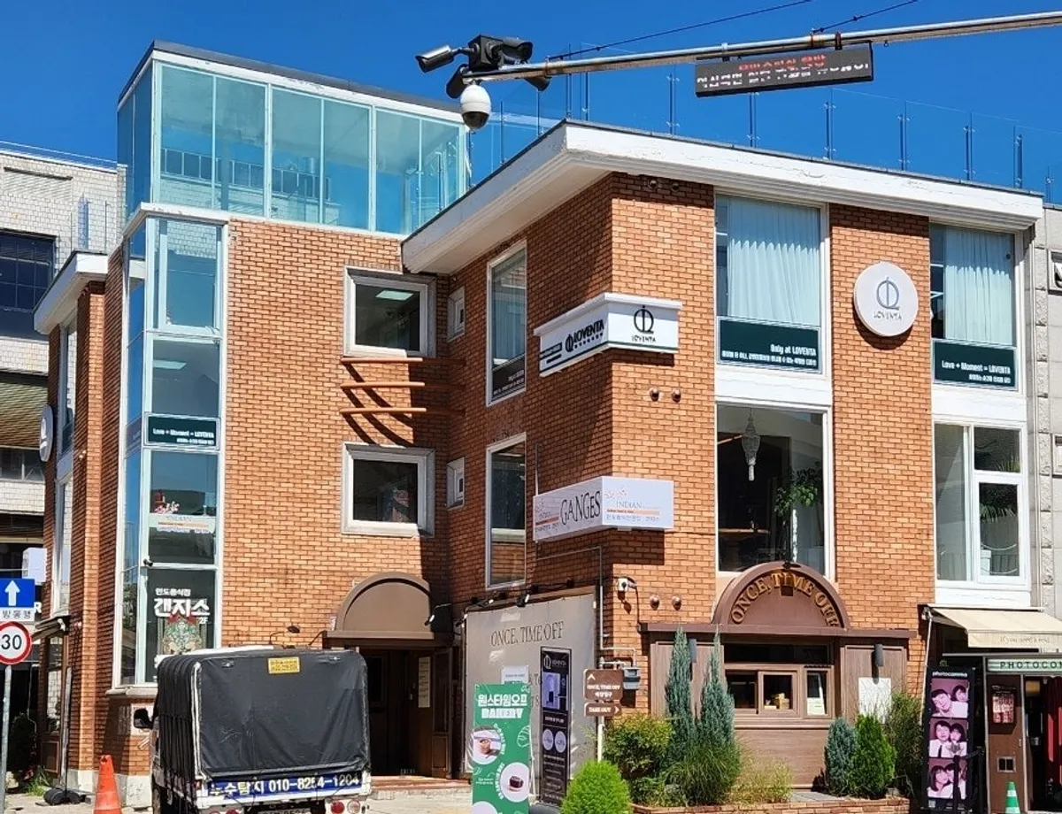 Exterior of the brick-toned building housing Loventa Suwon Haenggung