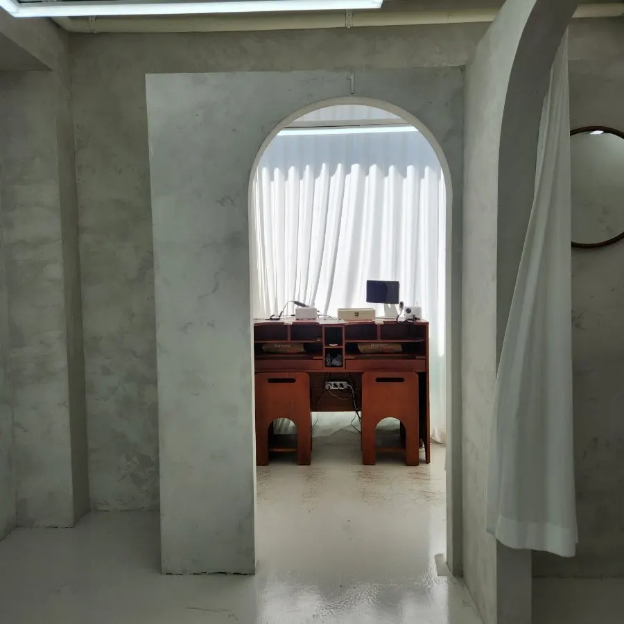 Private ring experience rooms divided by arched doorways