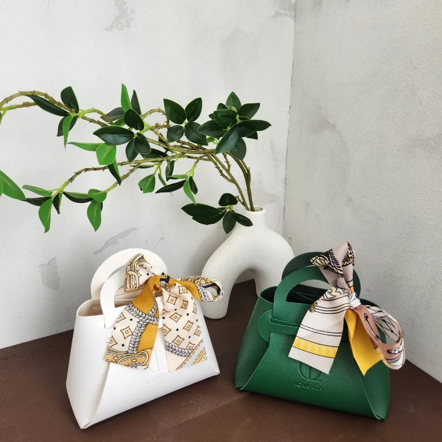 Green and white Loventa ring pouches