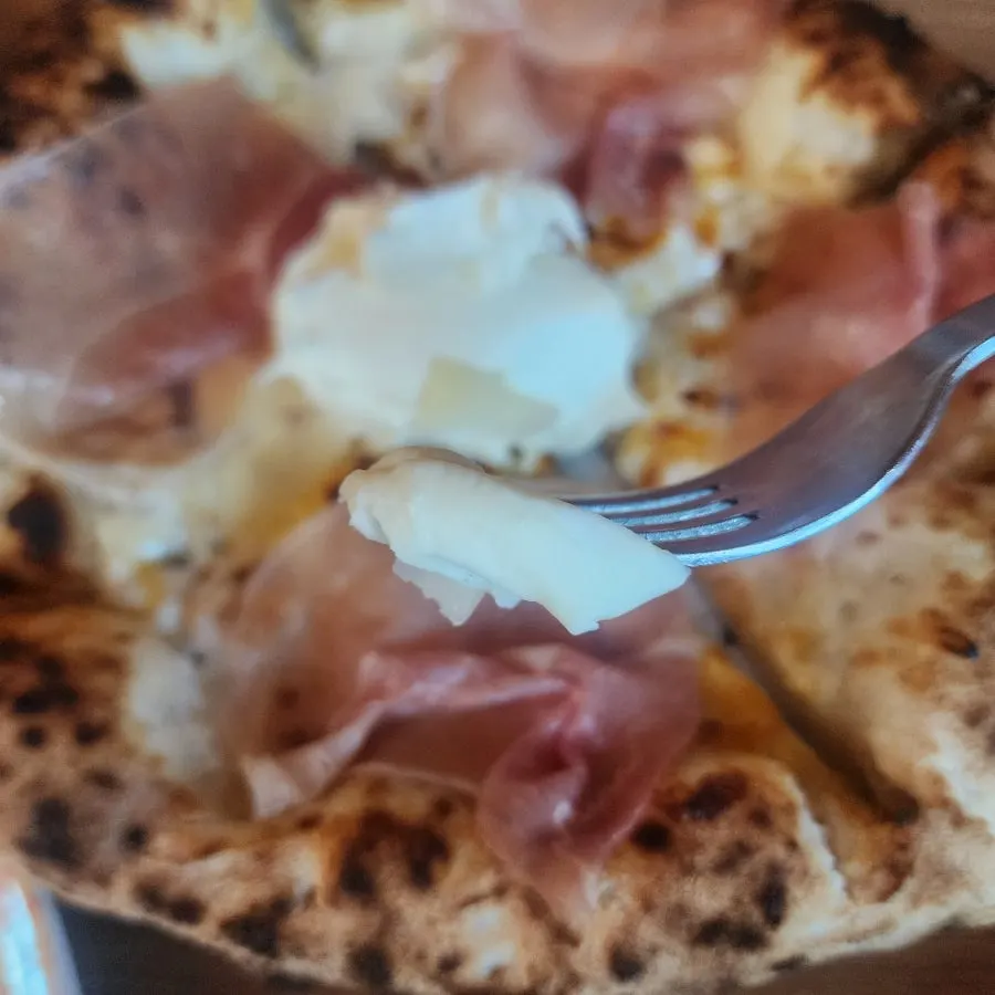 Pizza highlighting cheese and ham flavors