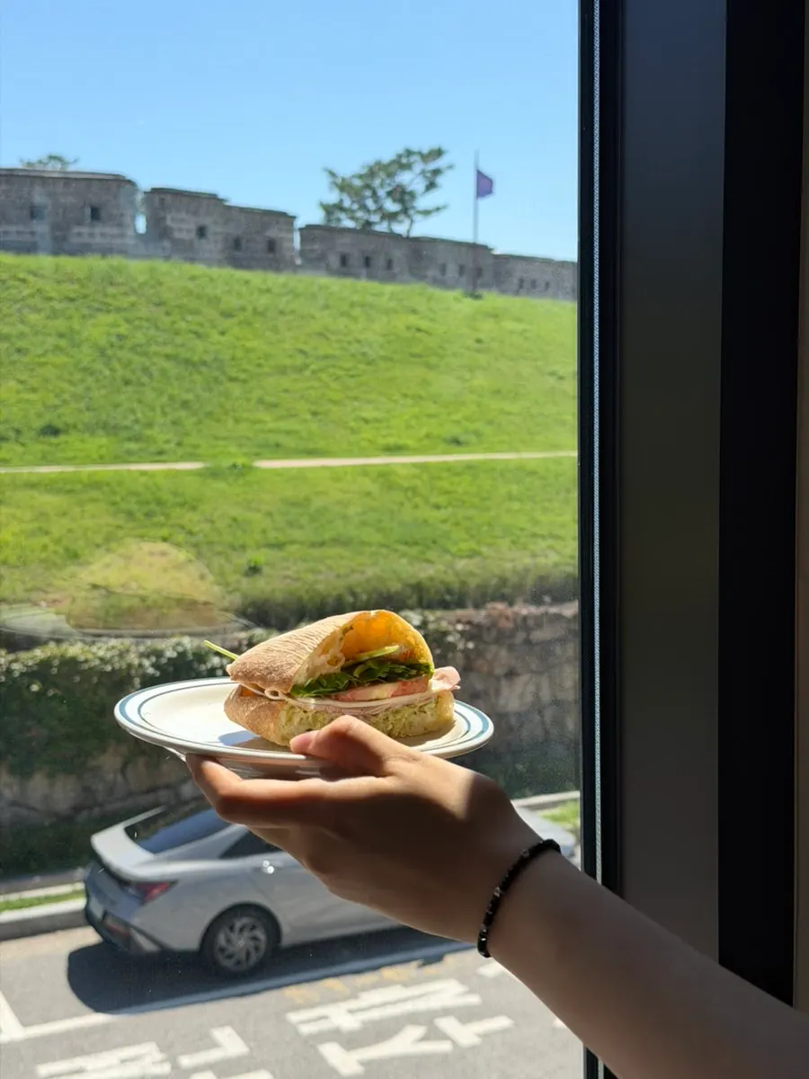 Inside of a ciabatta sandwich with basil pesto