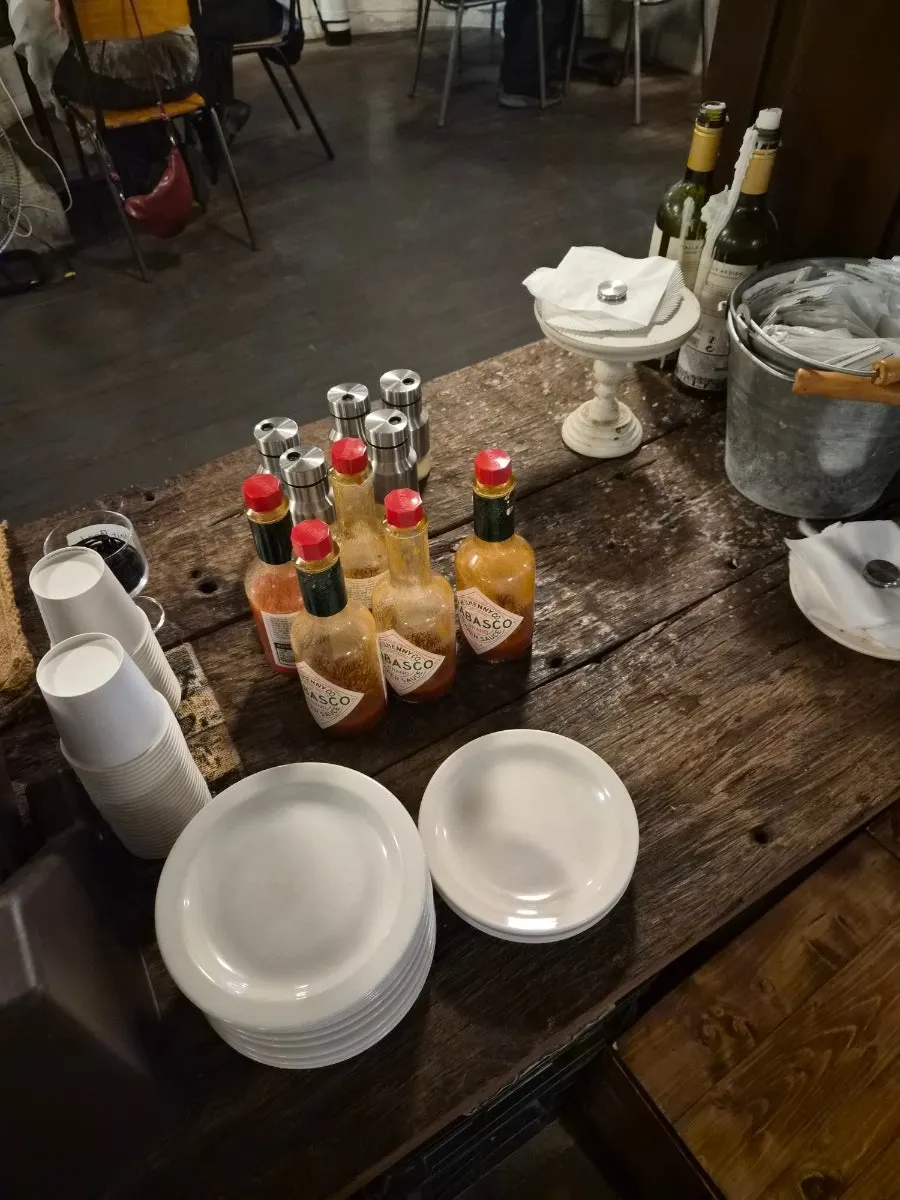 Hot sauce and cheese powder at the self-service bar