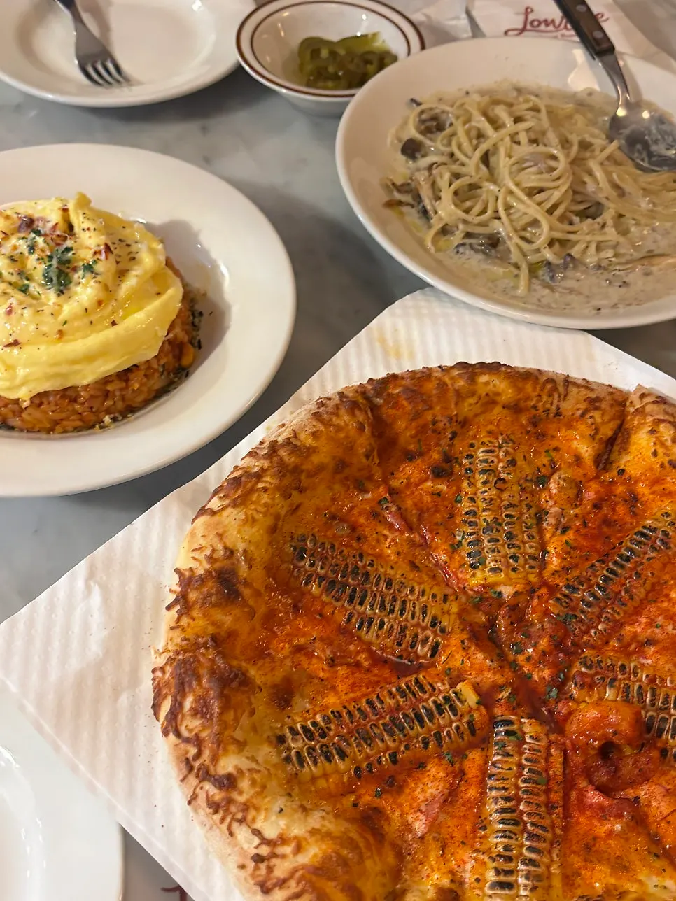 Signature pizza topped with corn