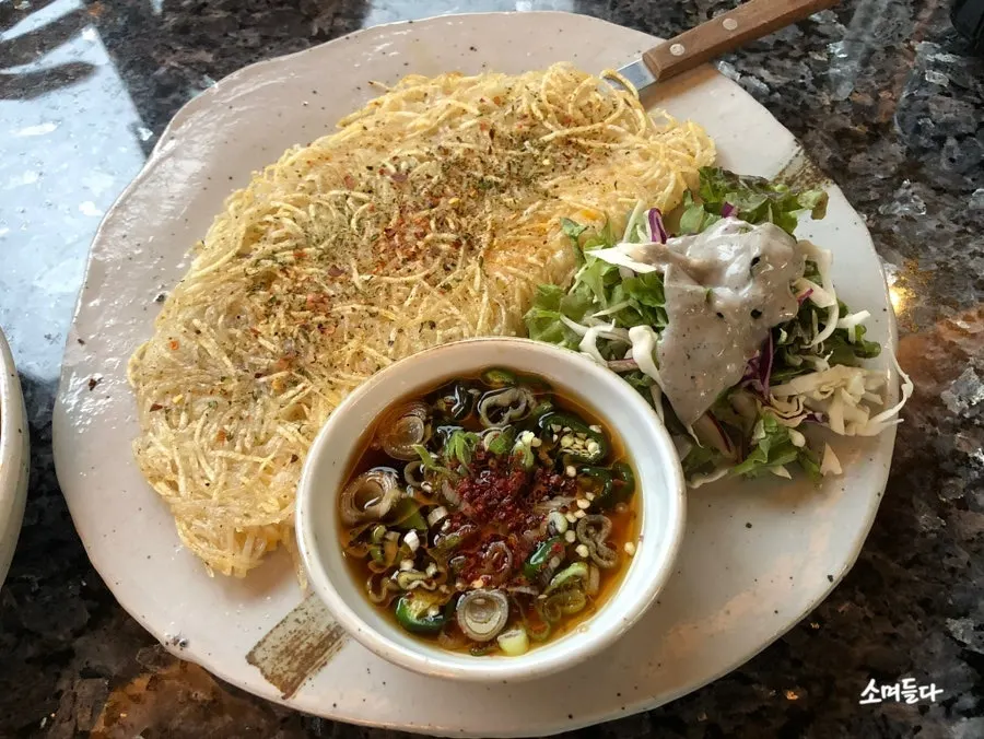 Shredded potato pancake with cheese and truffle aroma