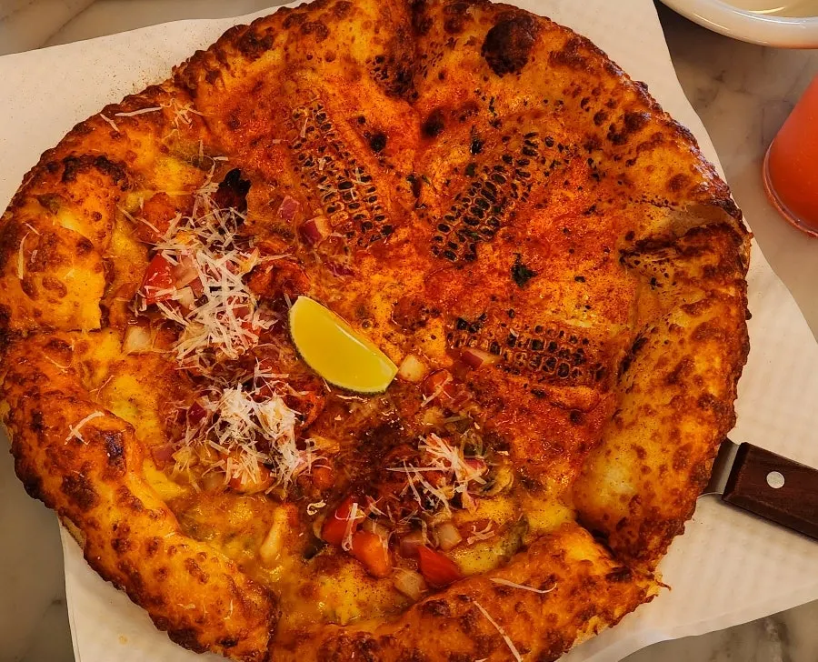 Corn-and-taco half-and-half pizza