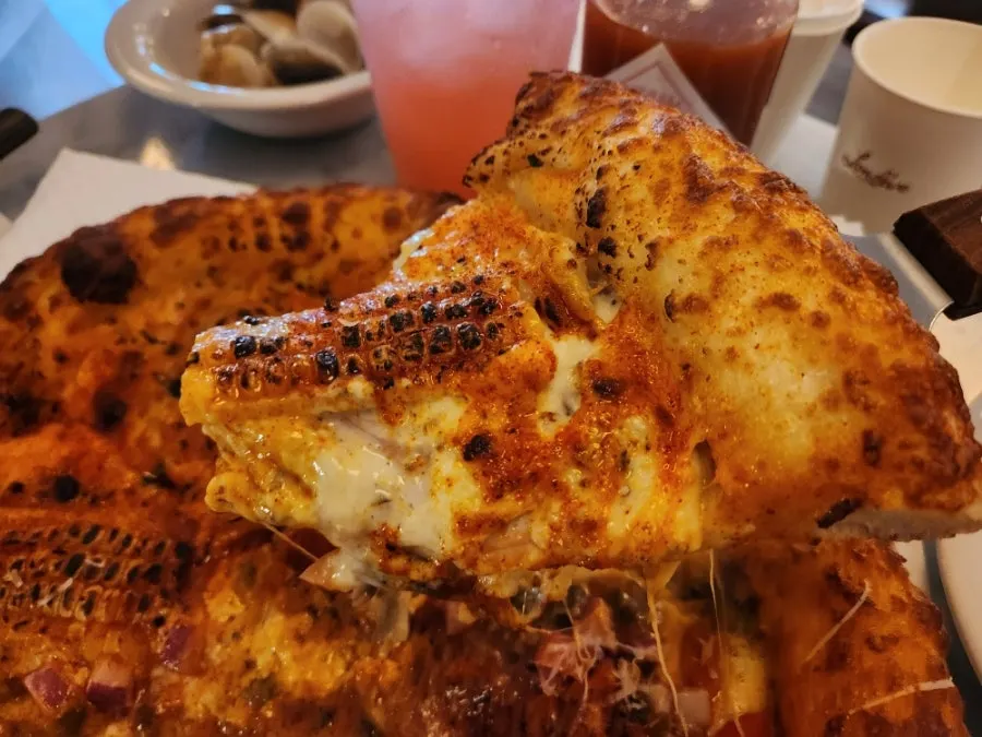 Eating corn pizza