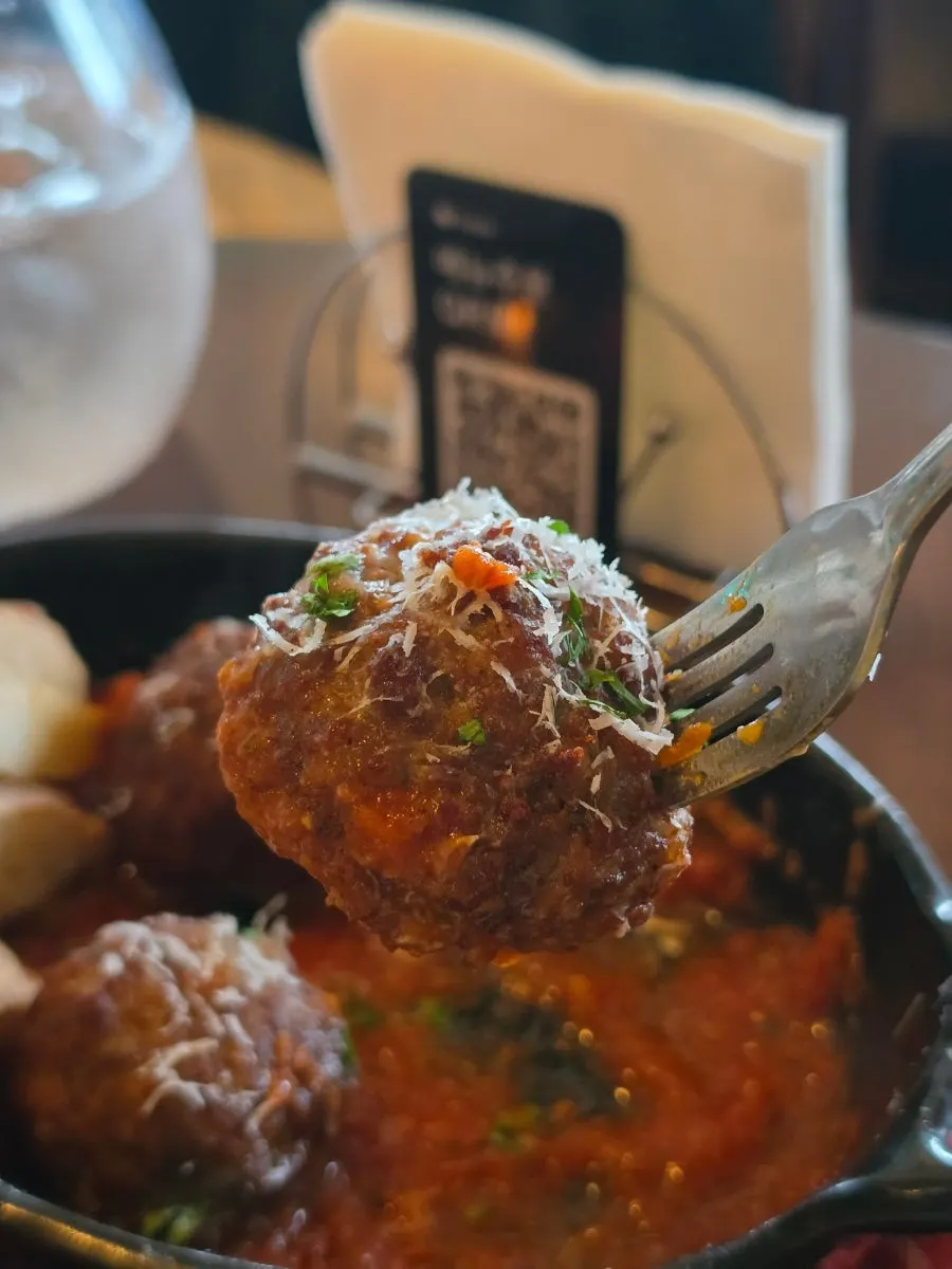 A plate of homemade meatballs and French baguette
