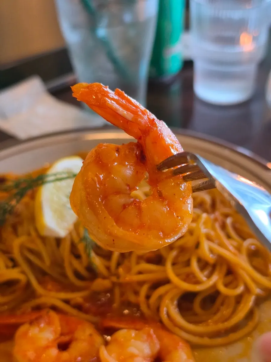 Plump shrimp on top of the bisque rosé pasta