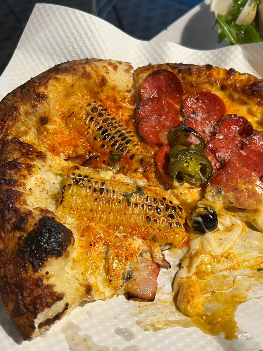 Half-and-half pizza with corn and hot pepperoni