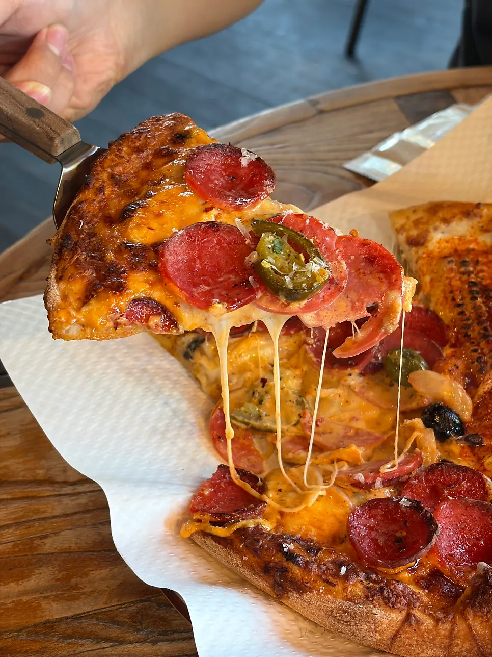Hot pepperoni pizza with red sauce and red onion