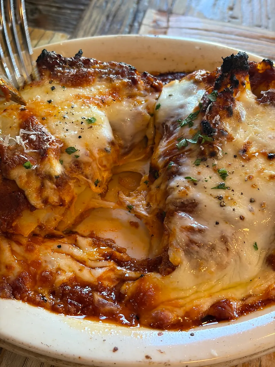 Classic lasagna topped with cheese and ragù sauce