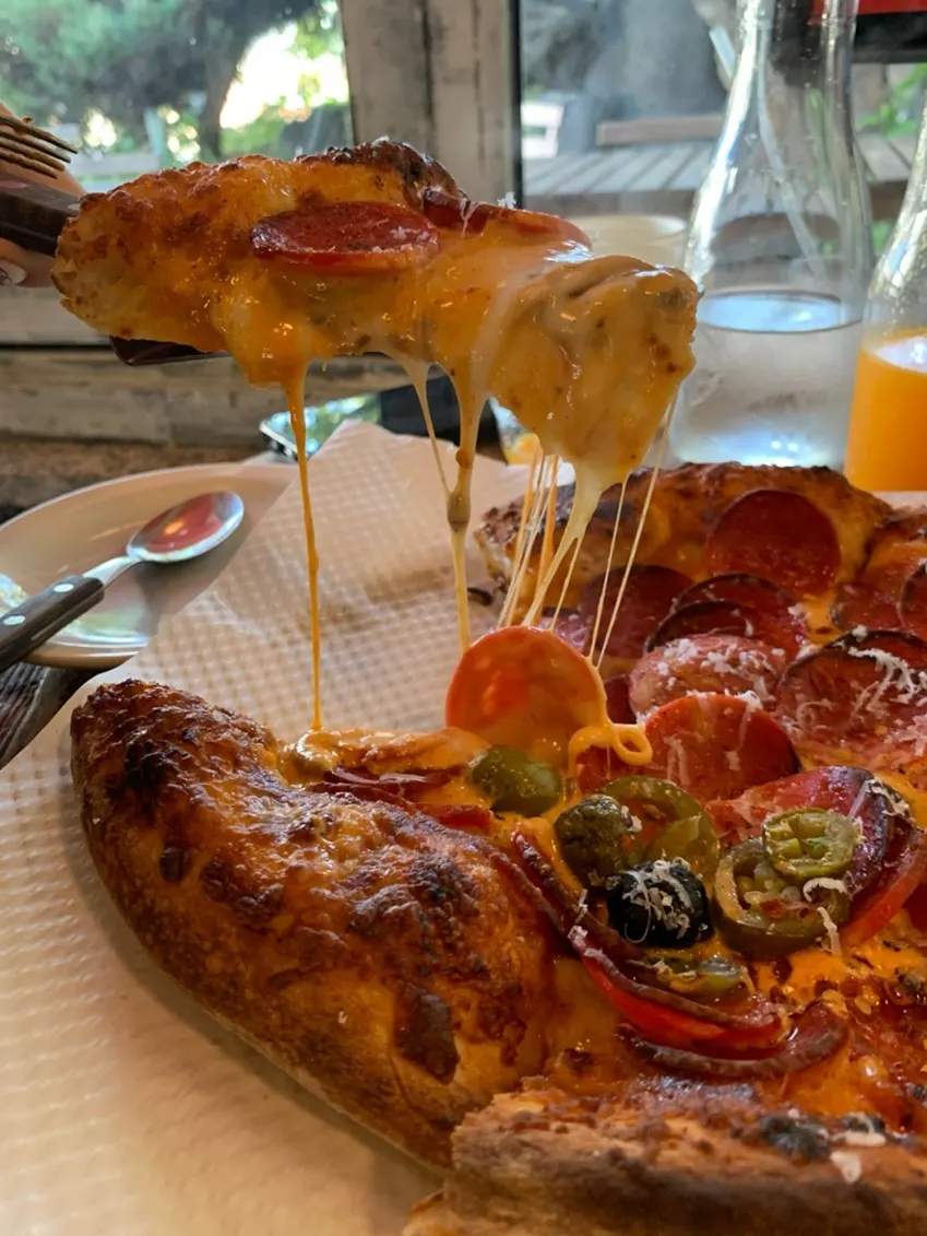 Pepperoni pizza topped with cheese and toppings