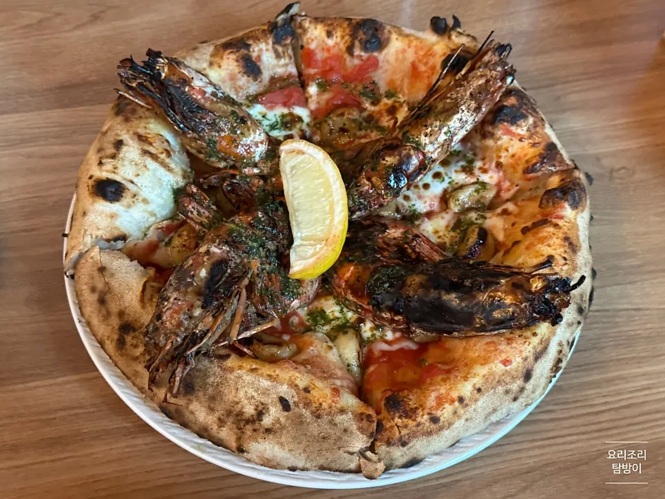 Whole shrimp garlic pizza with prawns on top