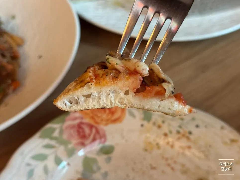Pizza slice topped with whole garlic cloves