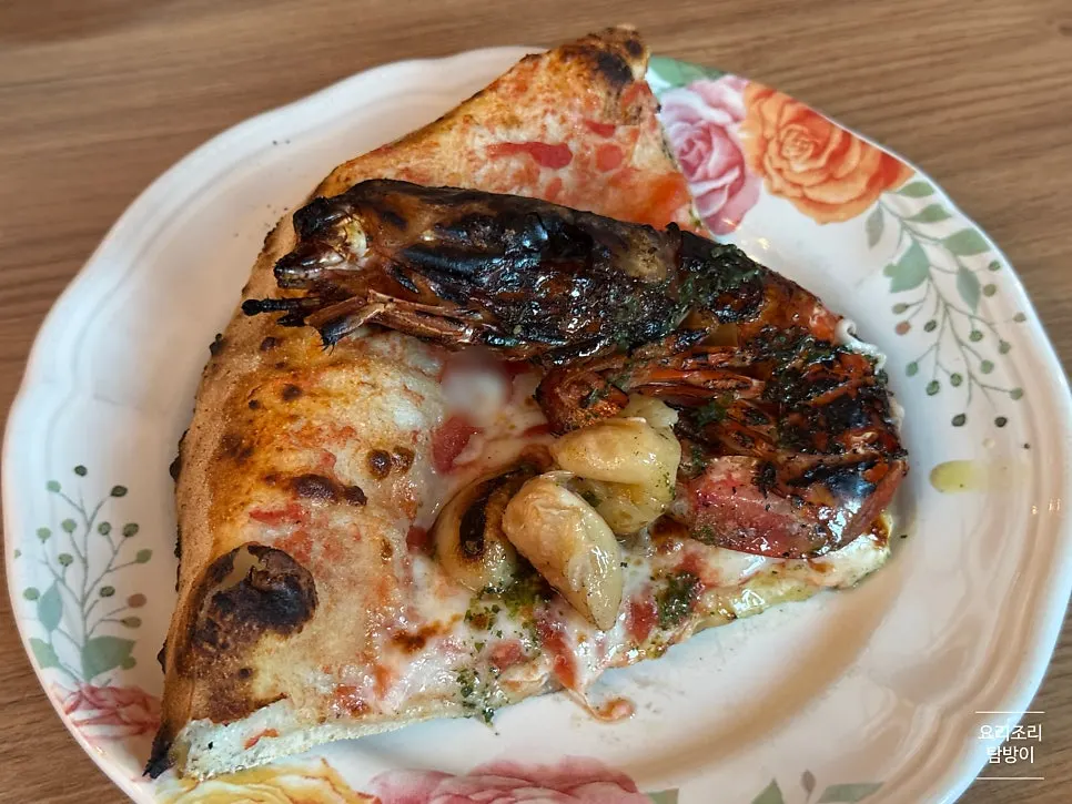 Golden-brown edge of the wood-fired pizza dough